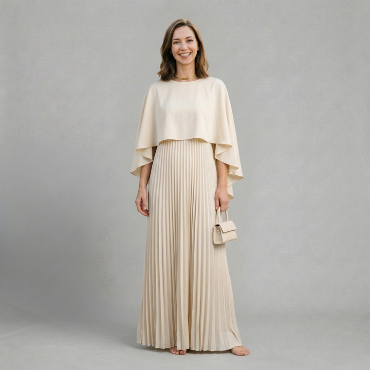 Evelyn - Elegant pleated maxi dress with flowing cape overlay