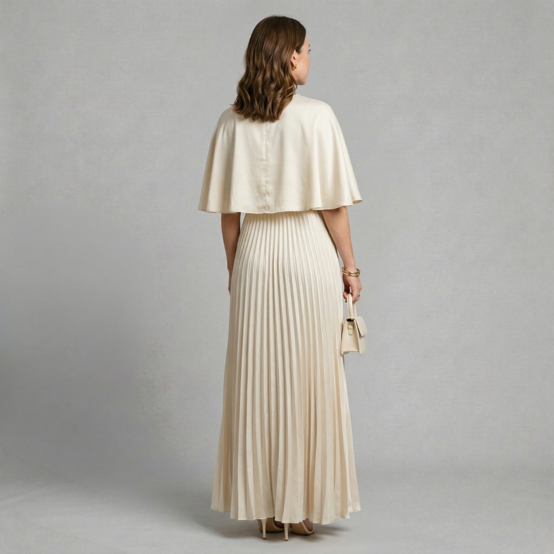 Evelyn - Elegant pleated maxi dress with flowing cape overlay